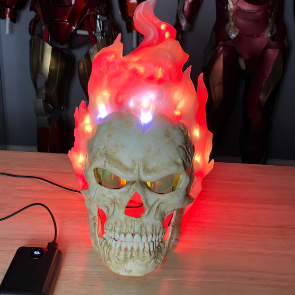 Skull mask with hair made of fire and night-vision eyes.