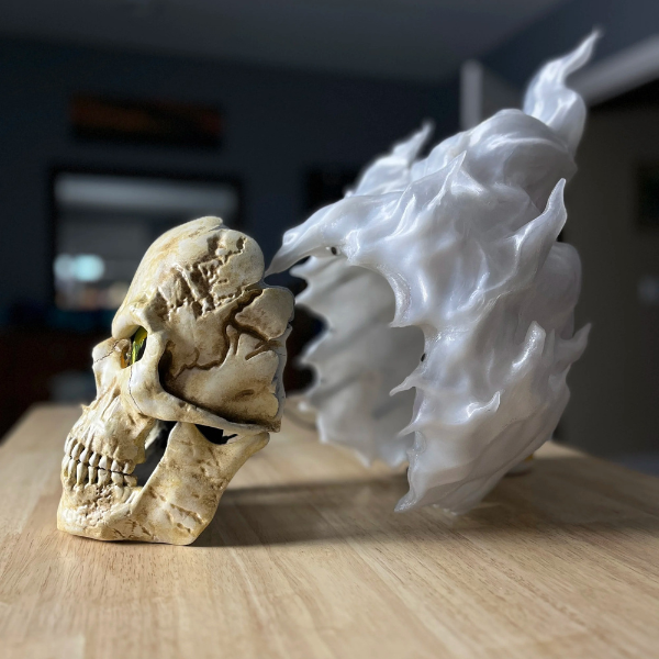 Skull mask with hair made of fire and night-vision eyes.